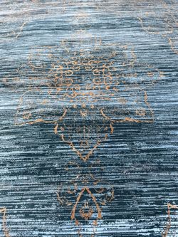 Blue rug with gold hilights