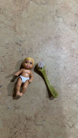 Baby barbie doll with brush