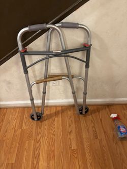 Folding walker for elderly or disabled person