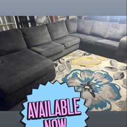 Blackish, grayish couch, good condition clean we sell all the time delivery extra 40 local