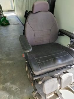 Powered wheelchair with charger