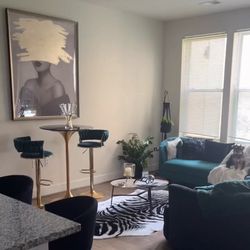 Emerald green love seat and two emerald green bar stools