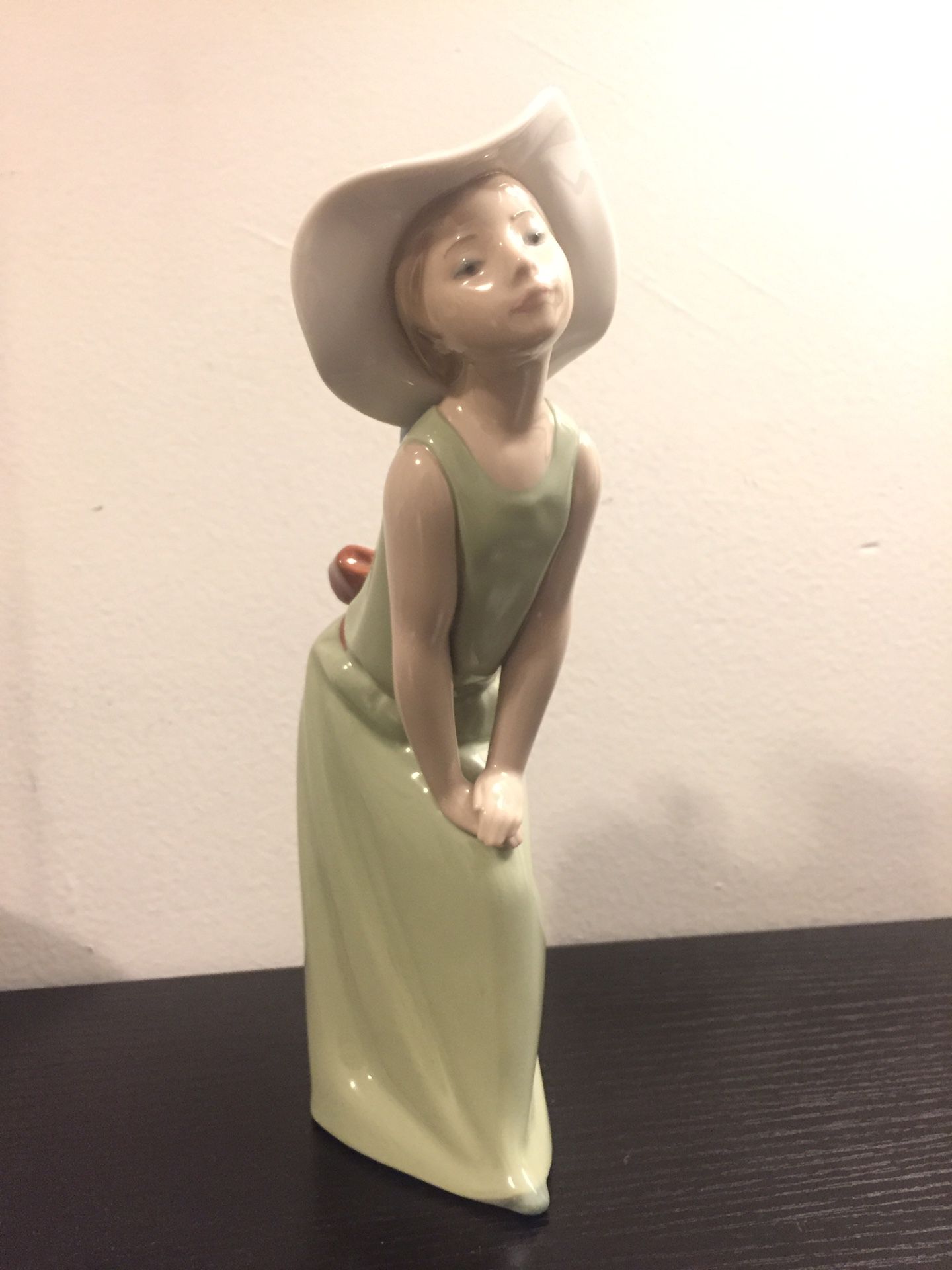 Lladro “Curious Girl with Straw Hat” Figurine