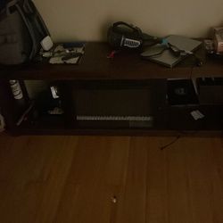desk/stand (has heating fireplace thing)