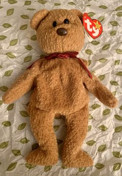 Curly beanie baby with tag errors