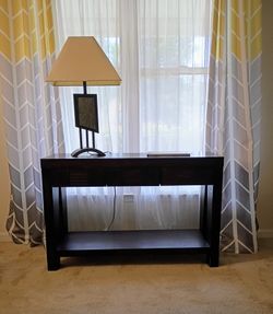 Dark wood coffee table. 46" x 16" x 30".