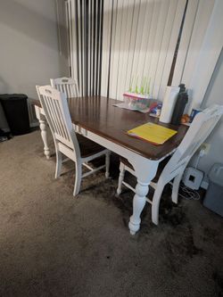 Wooden dining table with 4 chairs