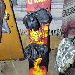 World Industries 141cm Snowboard With Bindings.