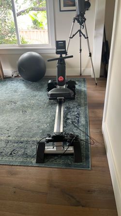 Rowing machine and strength trainer