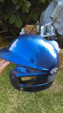 Blue or purple baseball or T-ball helmet