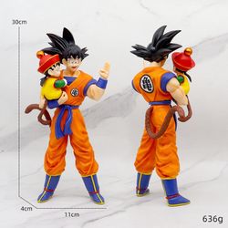Dragon Ball Z collectible statue featuring Son Goku holding  son, Gohan.