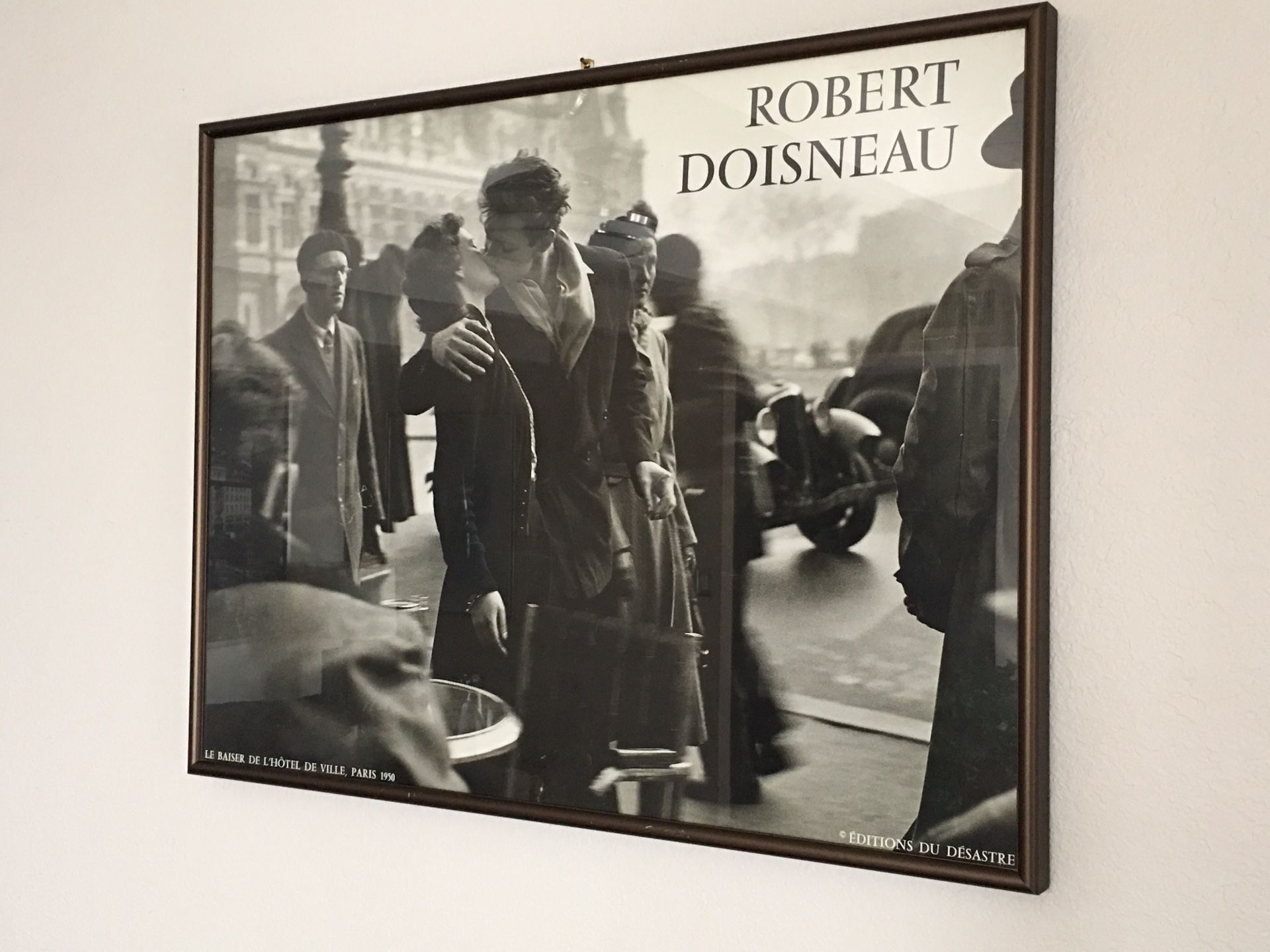 Kiss by the Hôtel de Ville Photograph by Robert Doisneau