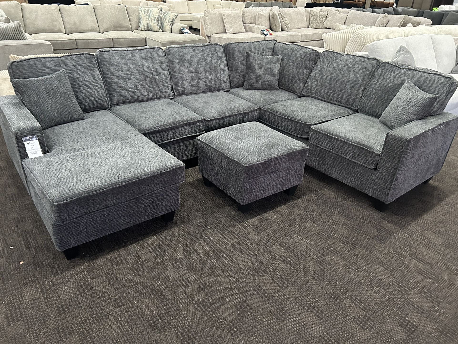 Gray Reversible Chaise Sectional And Ottoman