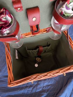 Cute picnic basket with wine glasses.