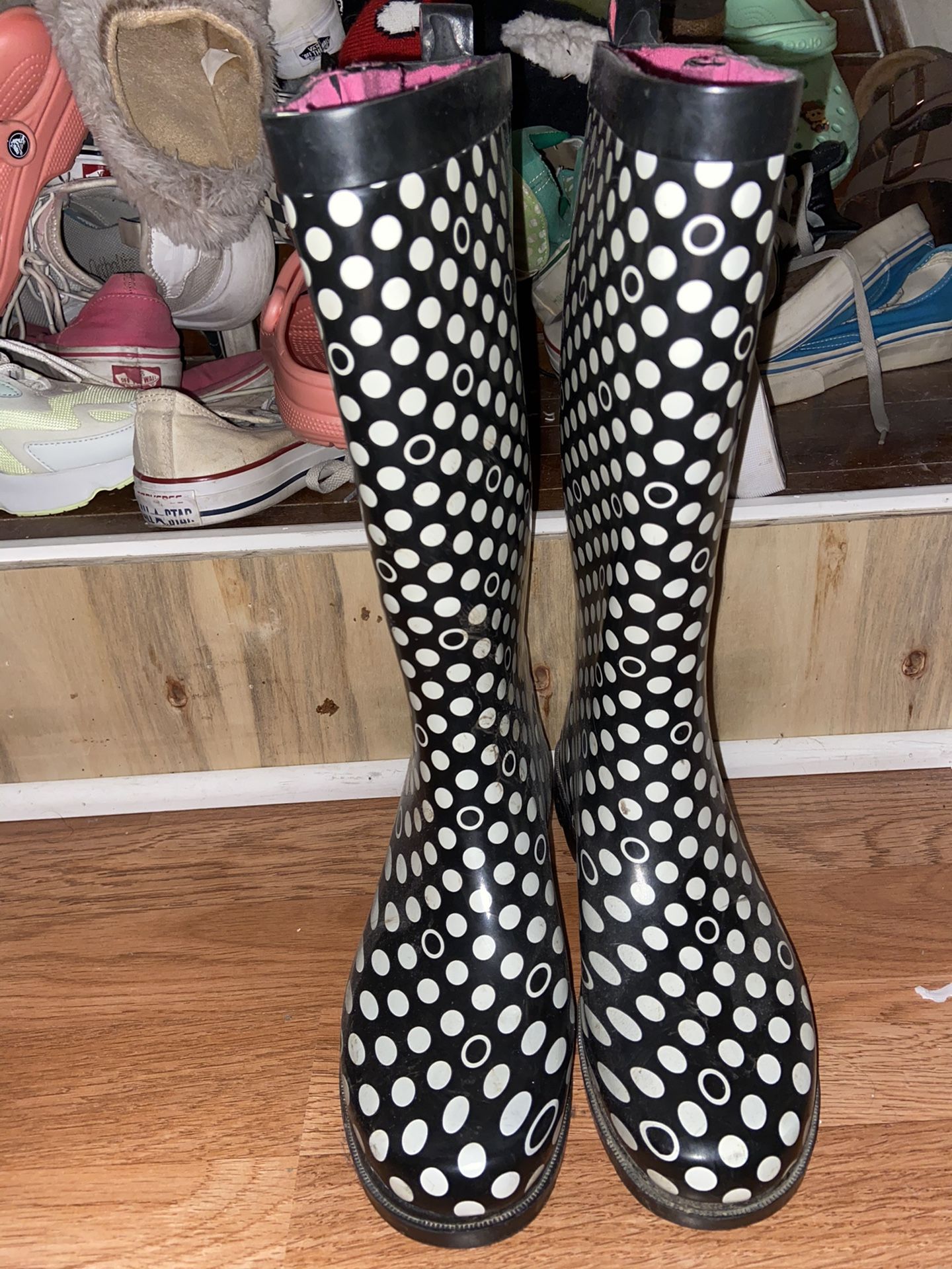 Tall black and white polka dot rain boots