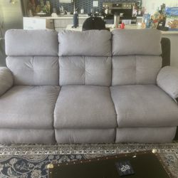 Gray Reclining Sofa with Drop Down Table