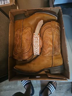 Pair of boots, size 8 and a 1/2.They run big