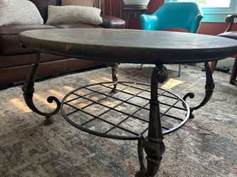 Genuine round marble coffee table with wrought iron base from Marley’s