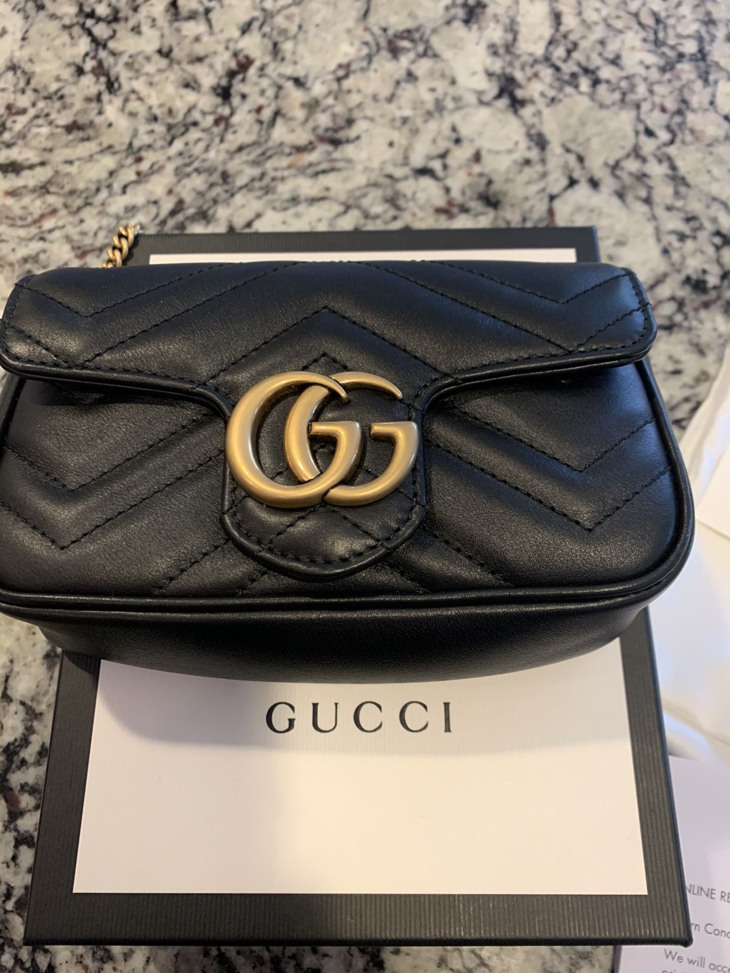 Gucci Marmont matelasse leather super mini bag black