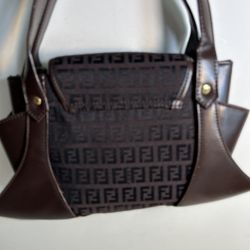  Coffee brown logo canvas & leather  purse handbag with golden lock collar & key small  Has 2 handles  Lining has logo + pockets