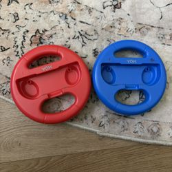 Red and blue Nintendo switch steering wheels 