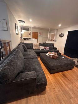 Dark blue couch with ottoman
