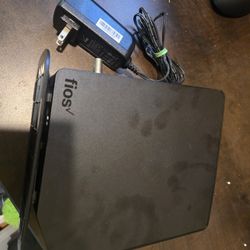 Verizon FiOS-G1100 router with cable and power cord.
