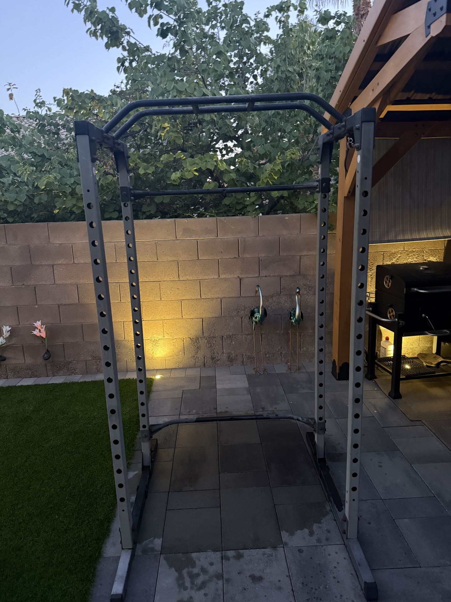 Squat rack with bar bell and weights