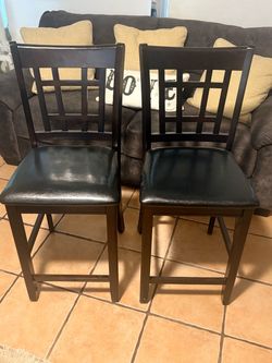 Pair of black counter height barstools