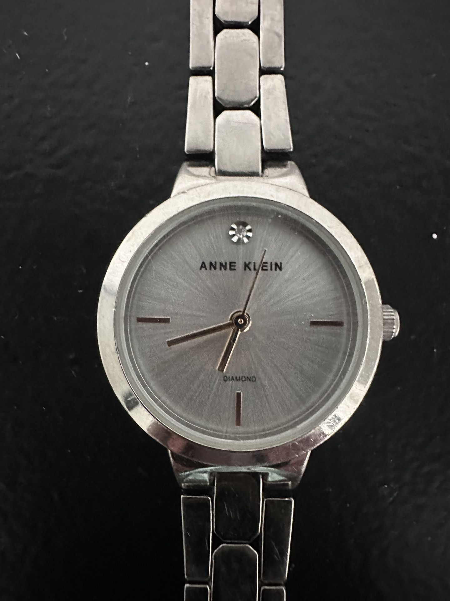 ANNE KLEIN SILVER TONE GENUINE DIAMOND DIAL WRISTWATCH.