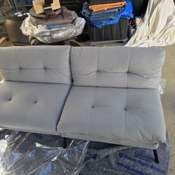 Folding Couch.  Adjustable Backrest and folds down to a bed. All NEW