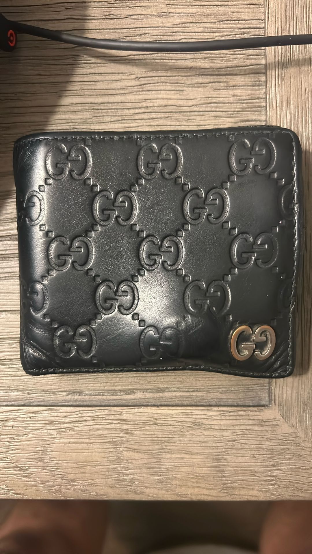 Authentic Gucci Black GG Embossed Leather Bifold Wallet – Used