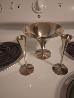 Two candle holders and decorative center piece