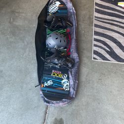 Snowboard with Bindings, Helmet, and Bag