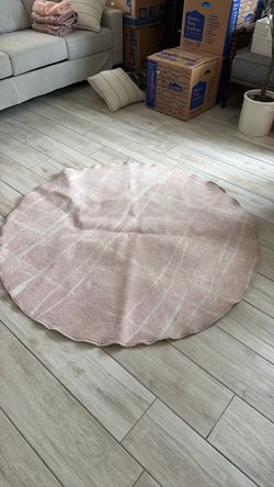 Round Pink Area Rug with Scalloped Edge