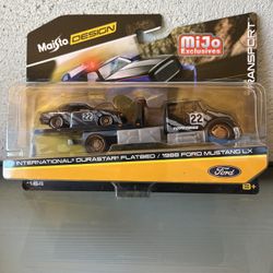 Maisto 1/64th Elite Transport International Durastar Flatbed & 1988 Ford Mustang