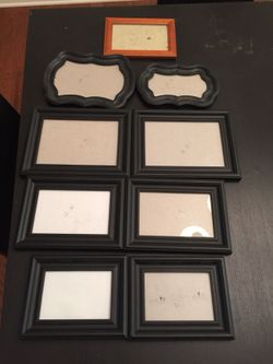 Nine wooden photo frames