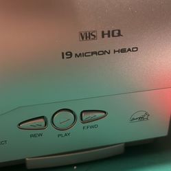 VHS Player And Tapes 