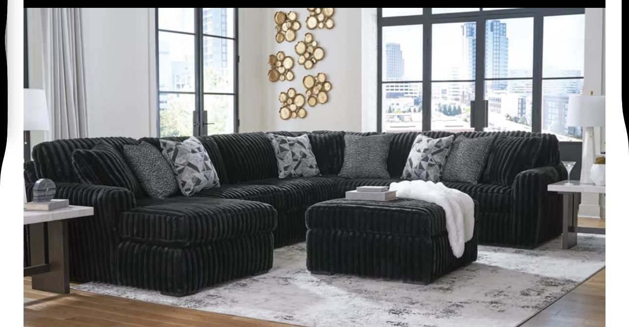 3 Piece Sectional Couch With Ottoman For $1900