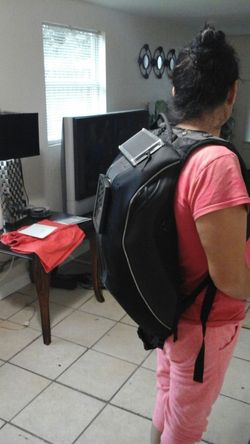 Solar powered motorcycle backpack