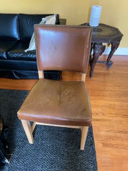 Brown stud chair, 36 inches tall 21 inches wide 18 inches deep