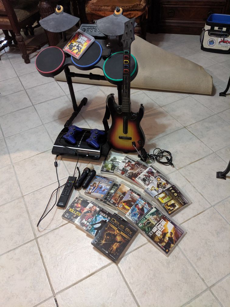 PS3 with 18 games 2 controller Motion controller Also have a guitar hero