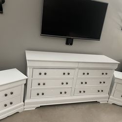 White dresser with 2 nightstands.