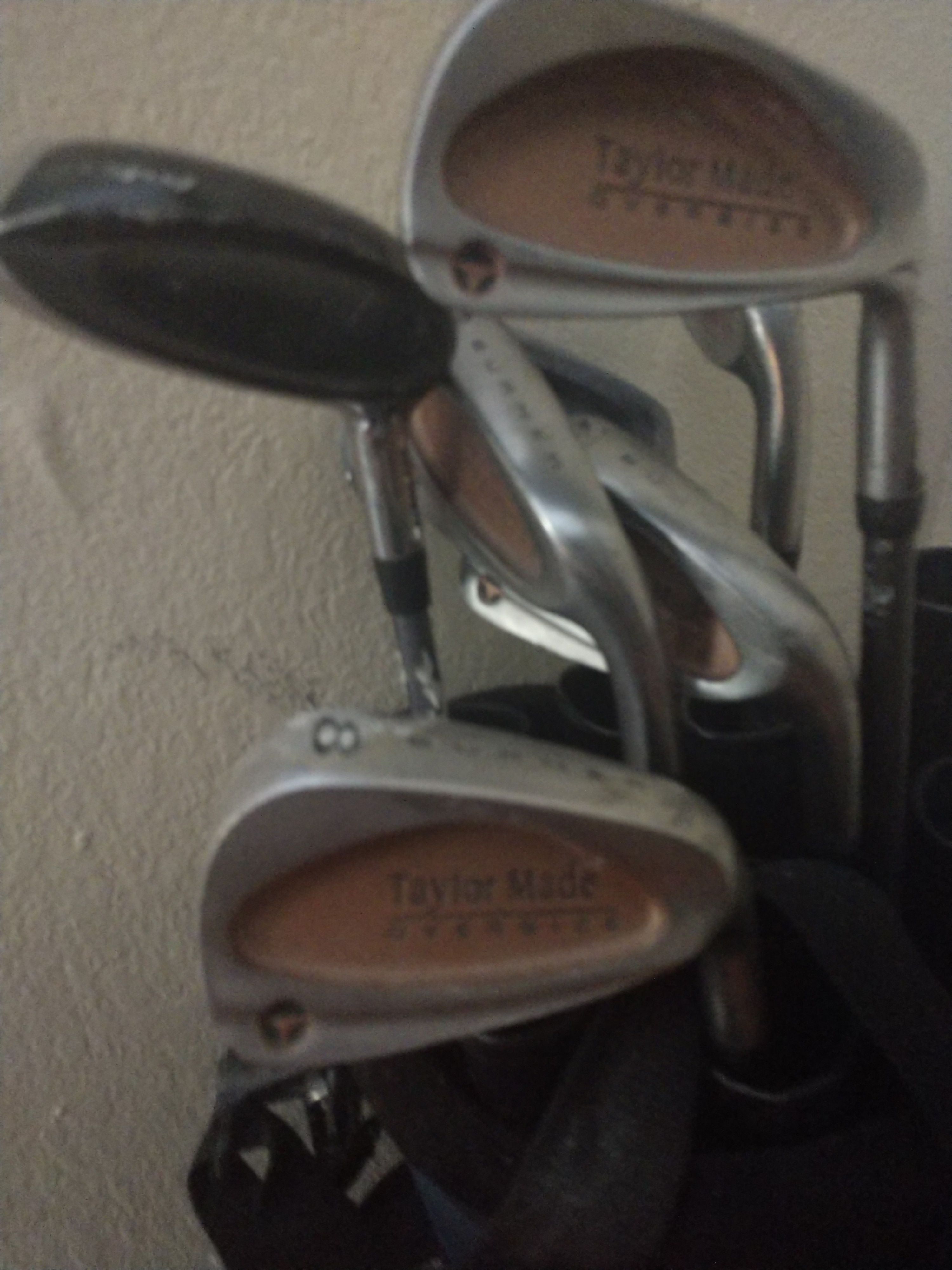 Golf clubs mostly taylor made total of 8 bag balls tees & more included