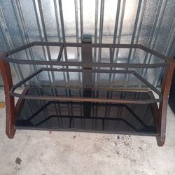 This Wood, Metal & Glass Entertainment Center/TV Stand