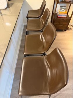 Four Faux Leather Barstools