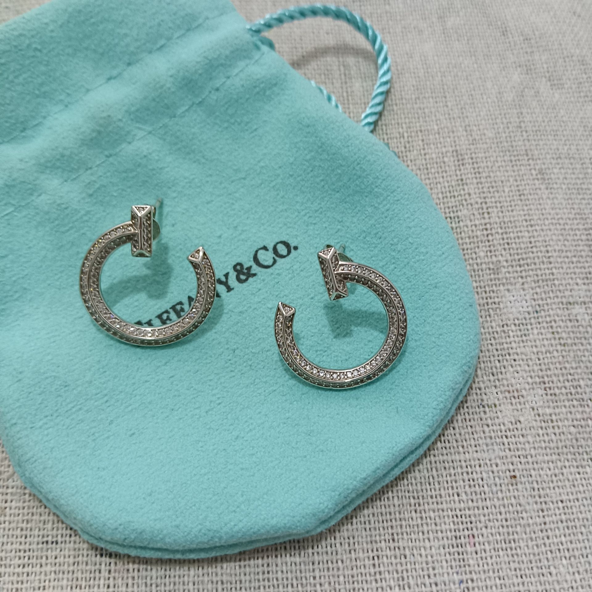 Tiffany & Co. T White Gold And Diamond Open Hoop EarringsTiffany & Co. T White Gold And Diamond Open Hoop Earrings