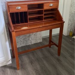 Compact wooden desk with pull out counter, and two drawers