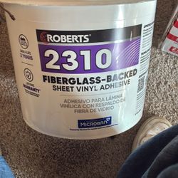 FIBERGLASS-BACKED SHEET VINYL ADHESIVE