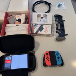 Nintendo Switch OLED (like New) including box,all original accessories, and lots of extras.